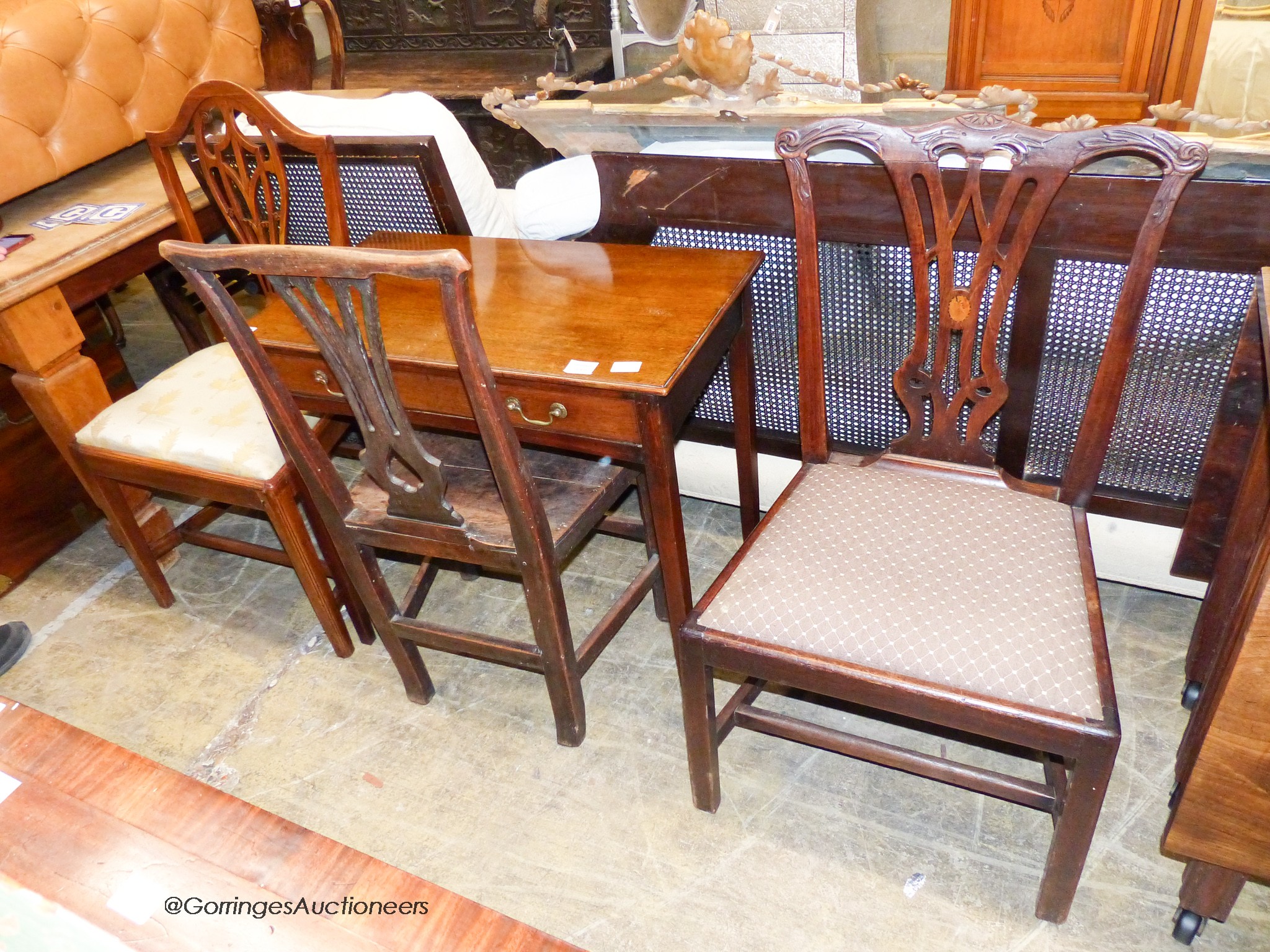 A George III mahogany side table, fitted with a long drawer, width 75cm, depth 42cm, height 70cm together with three Chippendale style mahogany dining chairs (4)